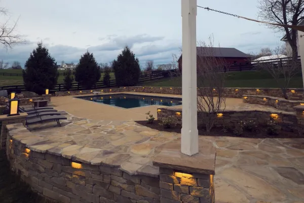 Hardscape-company-in-winchester-va-stone-patio-with-pool-lights